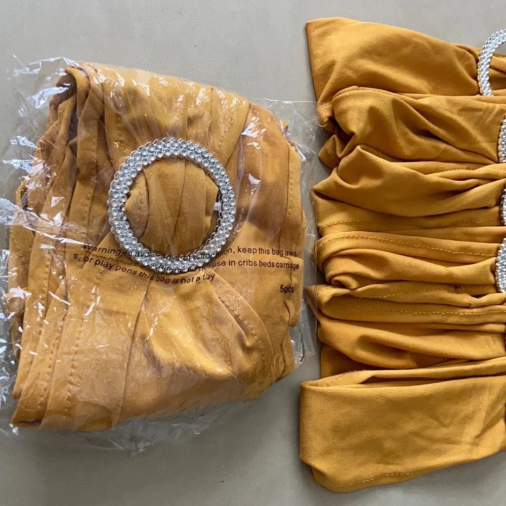 Chair Covers & gold chair bows New Year’s Eve, wedding, graduation, decor